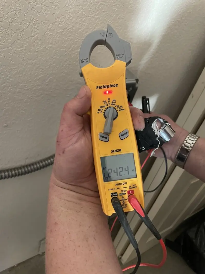 Voltage testing with clamp meter during Recessed Lighting Installation in Oxford